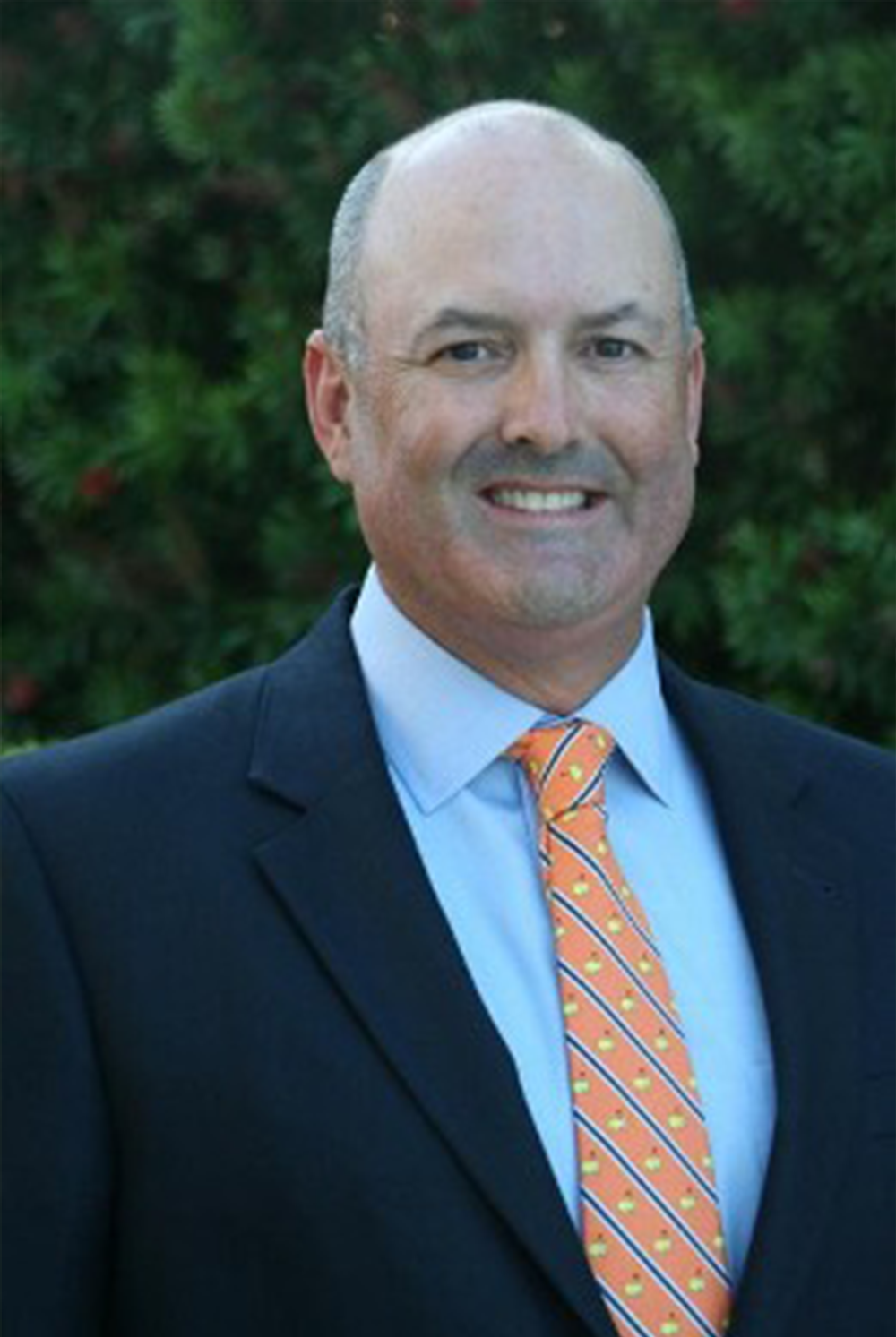 A professional-looking balding man in a suit