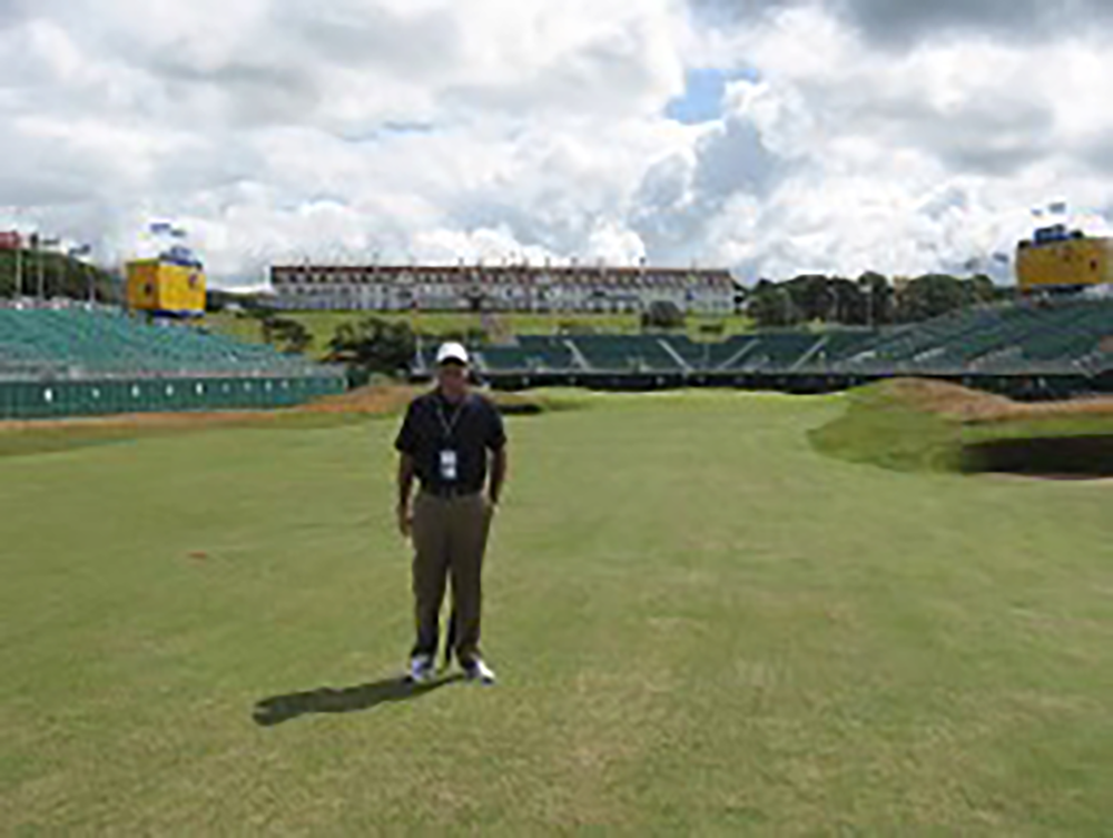Man standing in a golf course